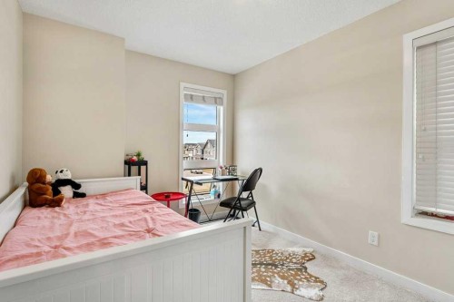 24 Copperpond Park Se, Calgary, AB - Indoor Photo Showing Bedroom