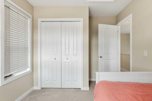 24 Copperpond Park Se, Calgary, AB - Indoor Photo Showing Bedroom
