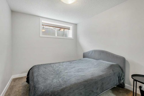 24 Copperpond Park Se, Calgary, AB - Indoor Photo Showing Bedroom