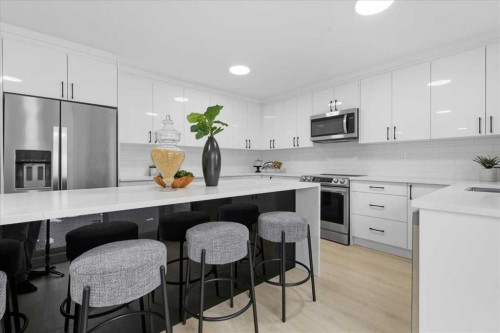 128 Deermoss Crescent Se, Calgary, AB - Indoor Photo Showing Kitchen With Stainless Steel Kitchen With Upgraded Kitchen