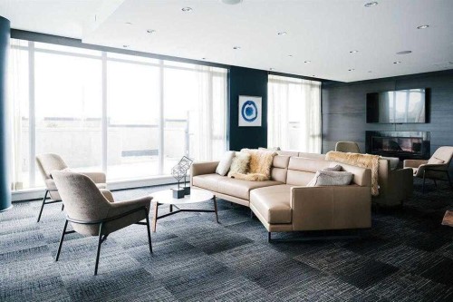 1002-1122 3 Street Se, Calgary, AB - Indoor Photo Showing Living Room With Fireplace