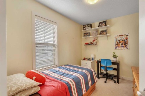 201-50 Belgian Lane, Cochrane, AB - Indoor Photo Showing Bedroom
