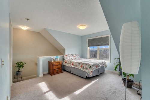 201-50 Belgian Lane, Cochrane, AB - Indoor Photo Showing Bedroom