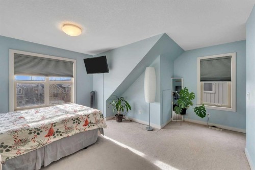 201-50 Belgian Lane, Cochrane, AB - Indoor Photo Showing Bedroom