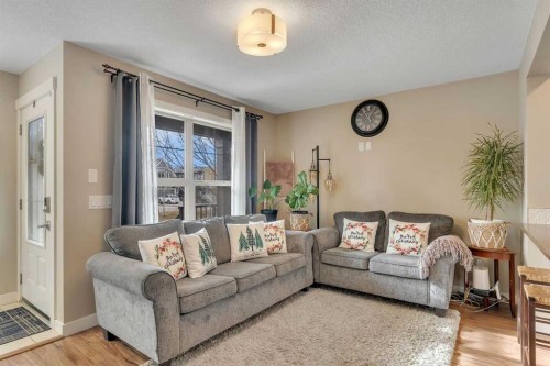 201-50 Belgian Lane, Cochrane, AB - Indoor Photo Showing Living Room