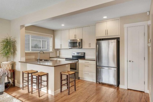 201-50 Belgian Lane, Cochrane, AB - Indoor Photo Showing Kitchen With Stainless Steel Kitchen With Upgraded Kitchen