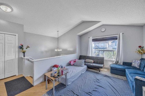 19 Saddlemont Way Ne, Calgary, AB - Indoor Photo Showing Living Room