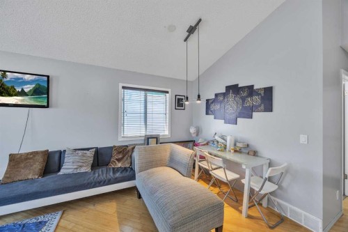 19 Saddlemont Way Ne, Calgary, AB - Indoor Photo Showing Living Room