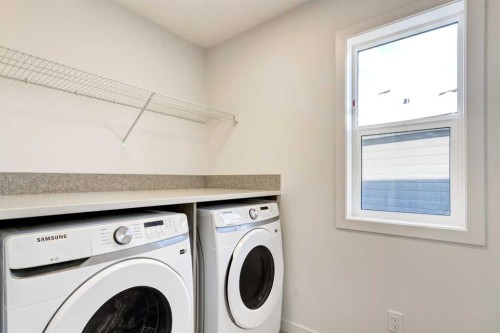 52 Magnolia Green Se, Calgary, AB - Indoor Photo Showing Laundry Room
