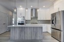 52 Magnolia Green Se, Calgary, AB  - Indoor Photo Showing Kitchen With Stainless Steel Kitchen With Upgraded Kitchen 