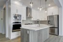 52 Magnolia Green Se, Calgary, AB  - Indoor Photo Showing Kitchen With Stainless Steel Kitchen With Upgraded Kitchen 