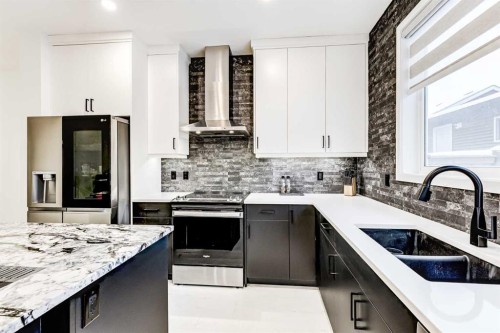 184 Rowmont Boulevard Nw, Calgary, AB - Indoor Photo Showing Kitchen With Double Sink With Upgraded Kitchen