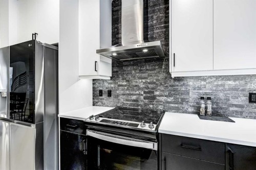 184 Rowmont Boulevard Nw, Calgary, AB - Indoor Photo Showing Kitchen With Upgraded Kitchen