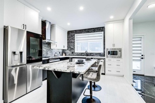 184 Rowmont Boulevard Nw, Calgary, AB - Indoor Photo Showing Kitchen With Upgraded Kitchen