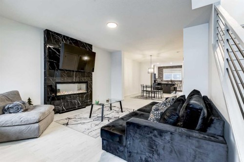 184 Rowmont Boulevard Nw, Calgary, AB - Indoor Photo Showing Living Room