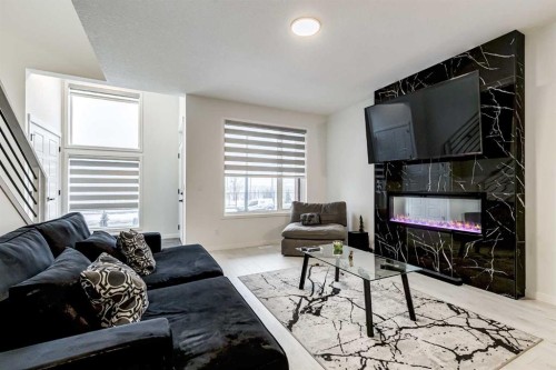 184 Rowmont Boulevard Nw, Calgary, AB - Indoor Photo Showing Living Room