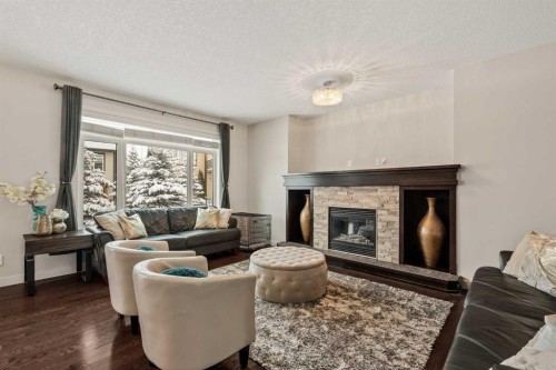 6 Crestridge Mews Sw, Calgary, AB - Indoor Photo Showing Living Room With Fireplace