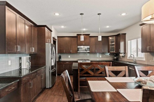 6 Crestridge Mews Sw, Calgary, AB - Indoor Photo Showing Kitchen With Stainless Steel Kitchen With Double Sink With Upgraded Kitchen