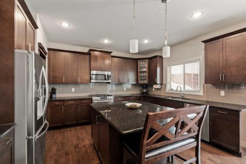 6 Crestridge Mews Sw, Calgary, AB - Indoor Photo Showing Kitchen With Stainless Steel Kitchen With Upgraded Kitchen