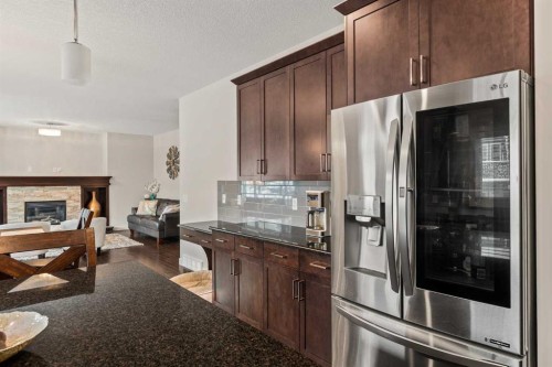 6 Crestridge Mews Sw, Calgary, AB - Indoor Photo Showing Kitchen With Fireplace