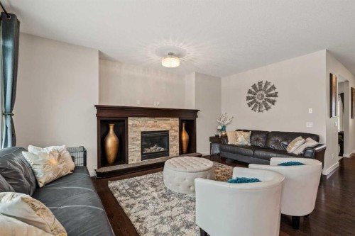 6 Crestridge Mews Sw, Calgary, AB - Indoor Photo Showing Living Room With Fireplace