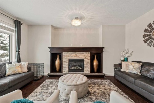 6 Crestridge Mews Sw, Calgary, AB - Indoor Photo Showing Living Room With Fireplace