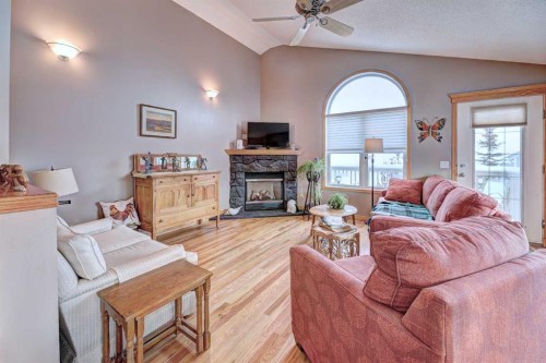73 Cresthaven View Sw, Calgary, AB - Indoor Photo Showing Living Room With Fireplace
