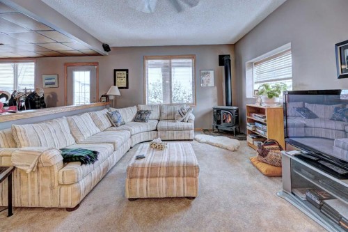 73 Cresthaven View Sw, Calgary, AB - Indoor Photo Showing Living Room With Fireplace