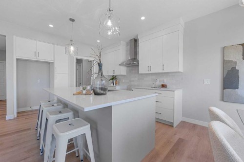 19 Clearwater Lane, Chestermere, AB - Indoor Photo Showing Kitchen With Upgraded Kitchen