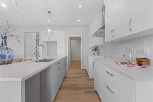 19 Clearwater Lane, Chestermere, AB - Indoor Photo Showing Kitchen With Upgraded Kitchen