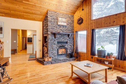 51 Manyhorses Drive, Rural Rocky View County, AB - Indoor Photo Showing Living Room With Fireplace
