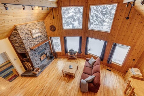 51 Manyhorses Drive, Rural Rocky View County, AB - Indoor Photo Showing Living Room With Fireplace