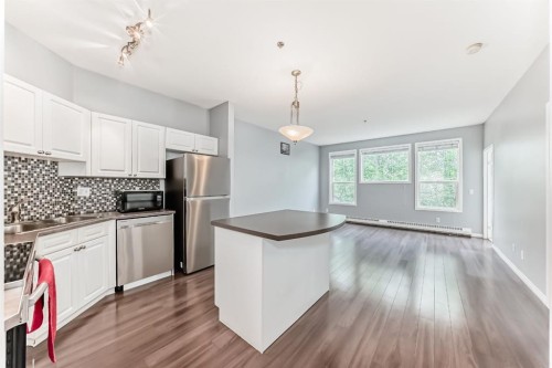 209-1000 Applevillage Court Se, Calgary, AB - Indoor Photo Showing Kitchen With Stainless Steel Kitchen With Double Sink