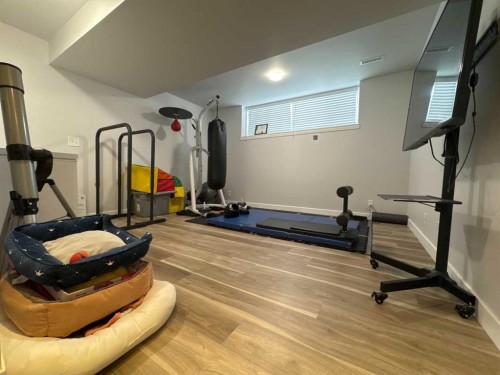 8-304 Ross Avenue, Cochrane, AB - Indoor Photo Showing Gym Room