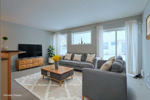 322 Country Village Cape Ne, Calgary, AB - Indoor Photo Showing Living Room