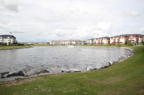 322 Country Village Cape Ne, Calgary, AB - Outdoor With Body Of Water With View