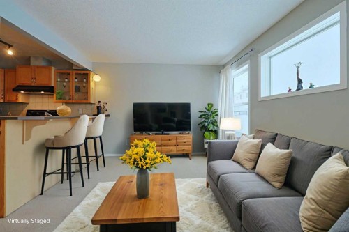 322 Country Village Cape Ne, Calgary, AB - Indoor Photo Showing Living Room