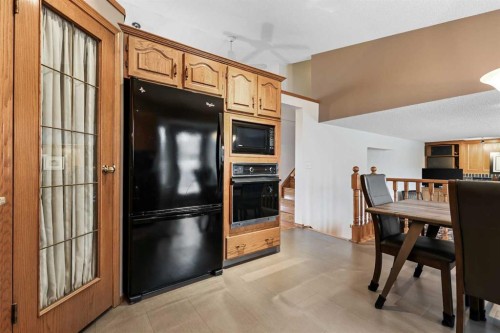 1208 Sunvista Way Se, Calgary, AB - Indoor Photo Showing Other Room