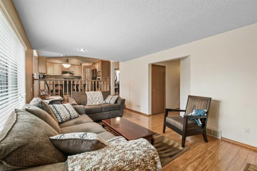 1208 Sunvista Way Se, Calgary, AB - Indoor Photo Showing Living Room