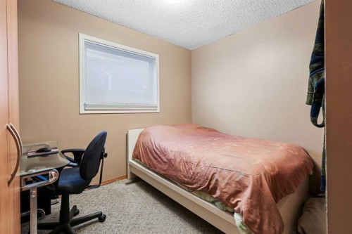 1208 Sunvista Way Se, Calgary, AB - Indoor Photo Showing Bedroom