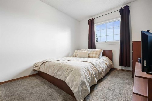 1208 Sunvista Way Se, Calgary, AB - Indoor Photo Showing Bedroom