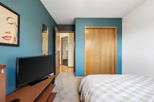 1208 Sunvista Way Se, Calgary, AB - Indoor Photo Showing Bedroom