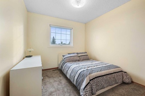 1208 Sunvista Way Se, Calgary, AB - Indoor Photo Showing Bedroom