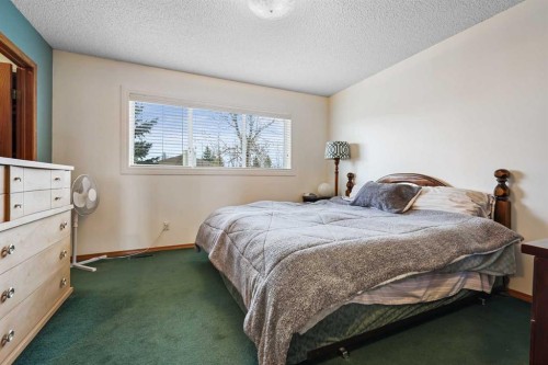 1208 Sunvista Way Se, Calgary, AB - Indoor Photo Showing Bedroom