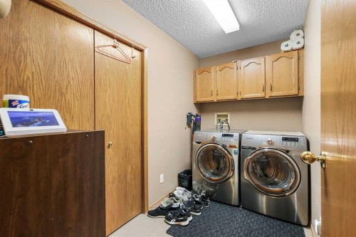 1208 Sunvista Way Se, Calgary, AB - Indoor Photo Showing Laundry Room