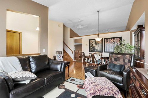 1208 Sunvista Way Se, Calgary, AB - Indoor Photo Showing Living Room