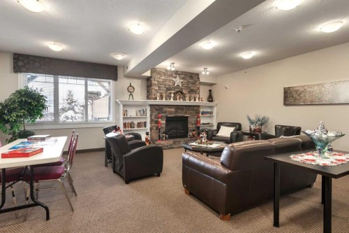 316-43 Sunrise Loop Se, High River, AB - Indoor Photo Showing Living Room With Fireplace