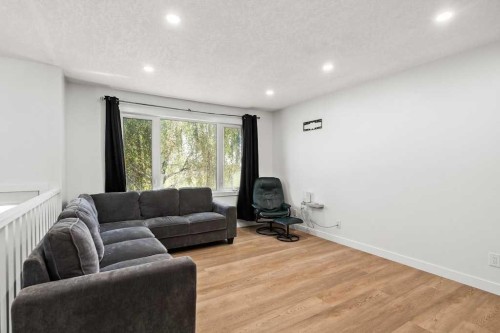856 Rundlecairn Way Ne, Calgary, AB - Indoor Photo Showing Living Room