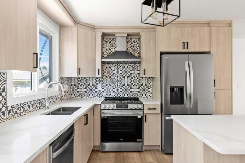 856 Rundlecairn Way Ne, Calgary, AB - Indoor Photo Showing Kitchen With Stainless Steel Kitchen With Double Sink With Upgraded Kitchen