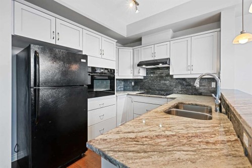 432-3111 34 Avenue Nw, Calgary, AB - Indoor Photo Showing Kitchen With Double Sink With Upgraded Kitchen